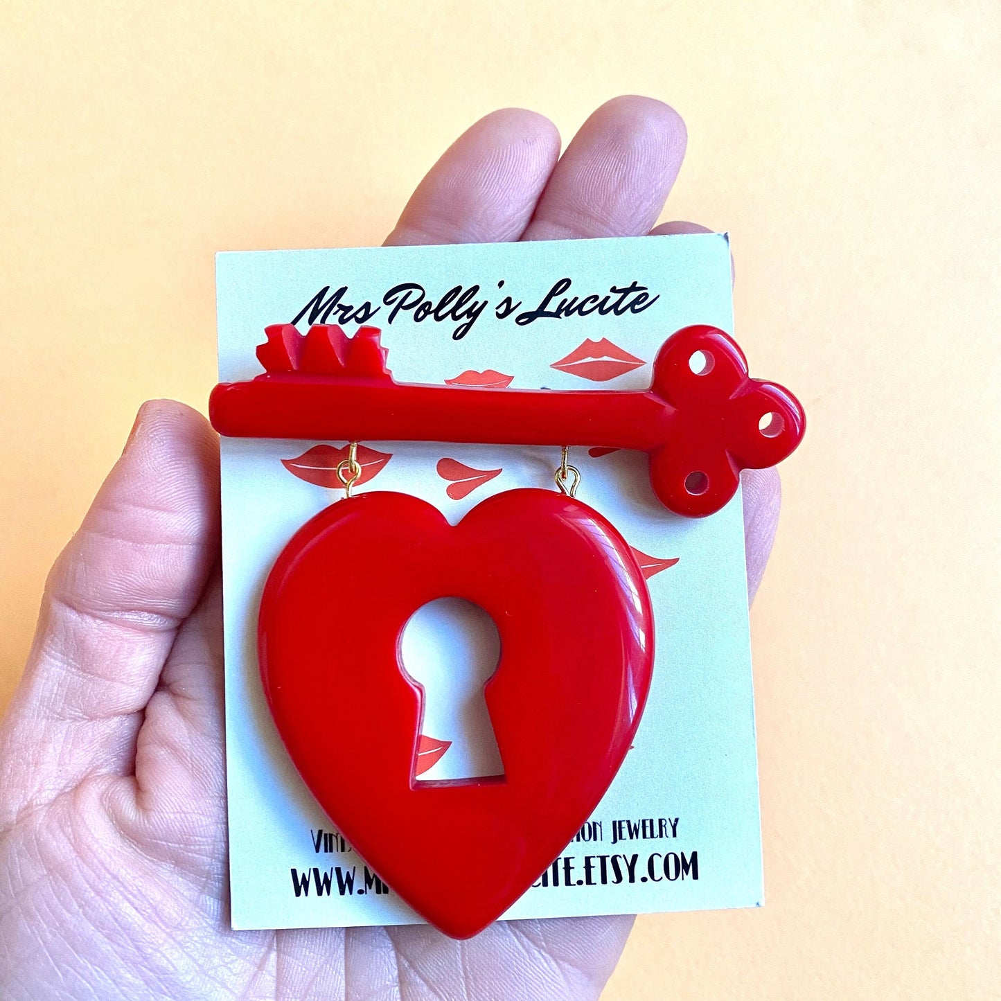 Heart and key brooch