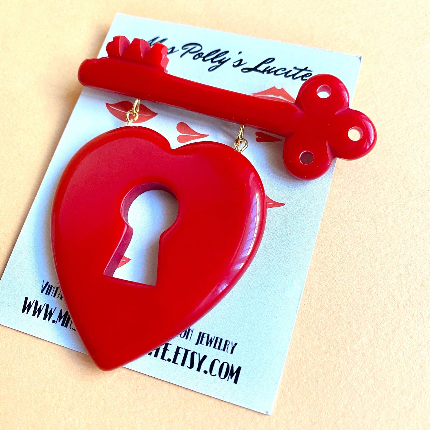 Heart and key brooch